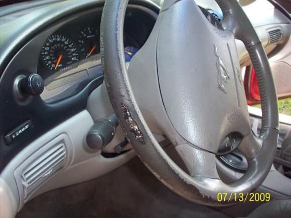 He had it 18 months.  The steering wheel was slightly worn when he got it...... DANG !