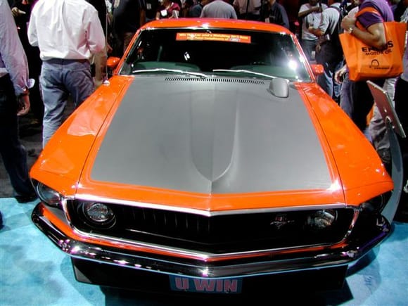 1969 Boss 302 Mustang from the front at the SEMA Show in Vegas, it looks orange but is actually in Calypso Coral.