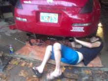 friend helping during exhaust replacement