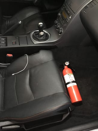 Fire extinguisher mounted to pass tech