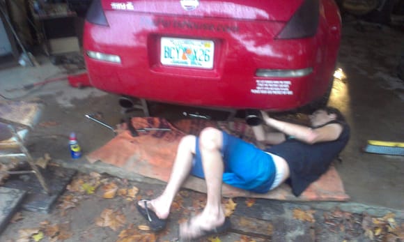 friend helping during exhaust replacement