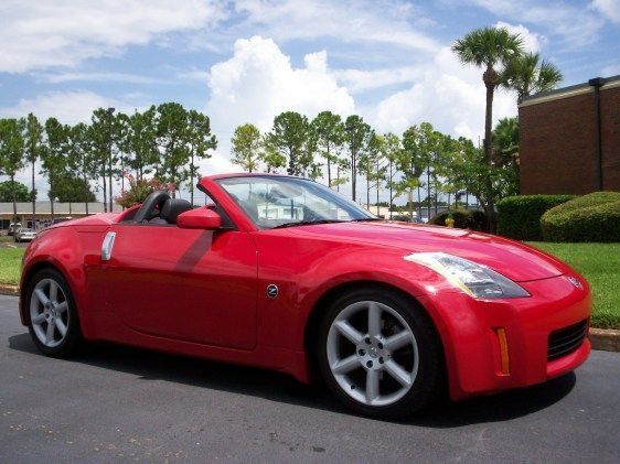 6/08 (Orlando, FL) Dealer Pics before I bought the car. 2004 350Z Roadster Touring model w/ 18" wheels and navigation. I flew 1100 miles to pick up and drive this car home to Michigan.
