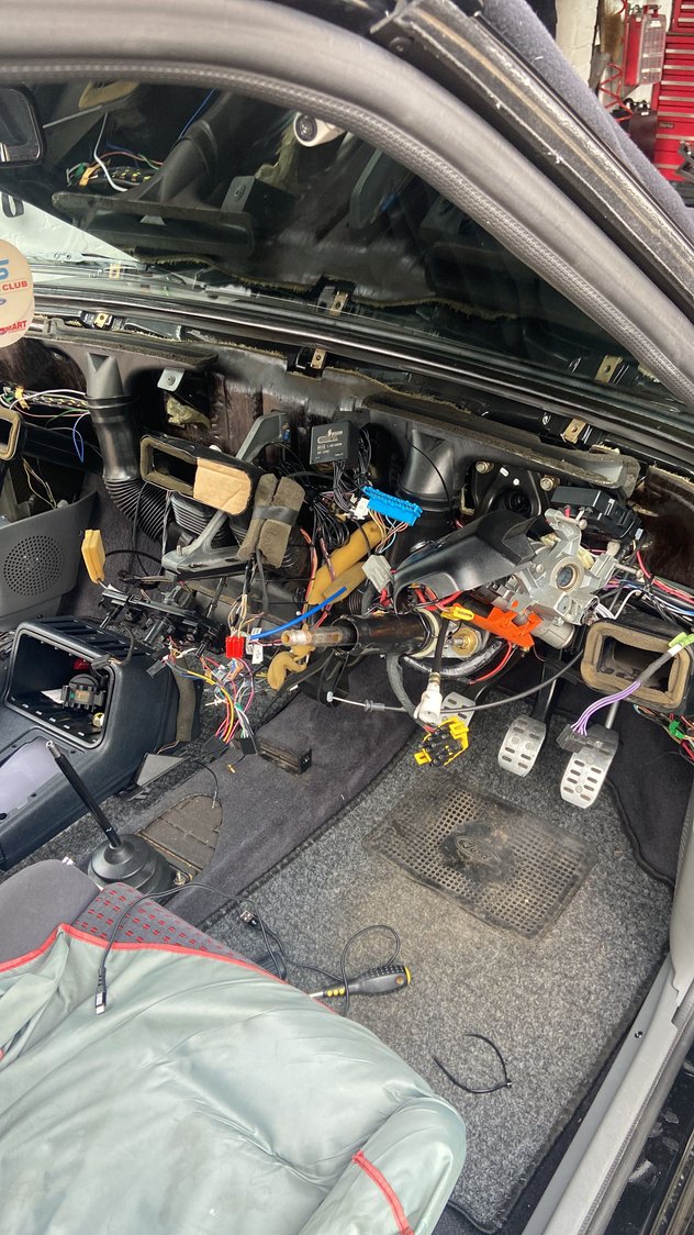 Took the dash out. I had read it was possible to do it with it in position but for a few screws this was easier. 