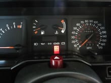 4x4 clocks

No numbers on fuel gauge
No seat belt icon inbetween fuel & temp
Red line on rev counter (6500-7000)
C under rev counter needle