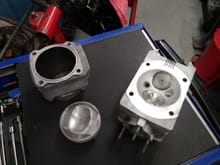 Piston, cylinder, and head going back into the car.