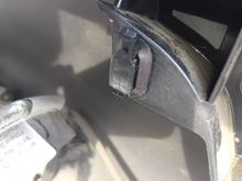 Clip on the rear bumper...connector slides up to release