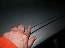 This is my fault!  Minor indentations above driver door from lifting my big butt in and out of the car inside the trailer.