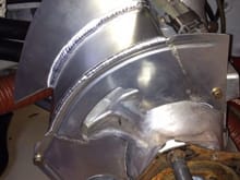Mounted to the hub. These pieces replace the factory heat shield. Air comes in and is directed to the hat of the rotor, allowing fresh air to go through the vanes, thus reducing overall disk temperature.