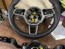 Original non-heated steering wheel and original clock spring after removal 