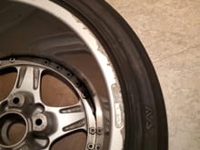 damage on rear wheel, installer screw up?