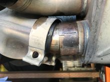 LH end of muffler similar to RH end. Not enough side movement possible to drop one end of the muffler to remove.