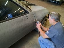 This is Ellis finishing up the weld at the door hinge.