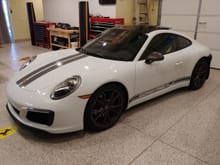 I ordered the car with the side stripe delete and then added the "Porsche" ones from Renndecals.com in dark silver which matches the mirror and wheels perfectly.