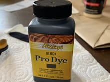 Fiebing's Pro Dye (product created to dye leather.) This product is color-fast and resists fading according to the manufacturer. This stuff was about $8 on Amazon 