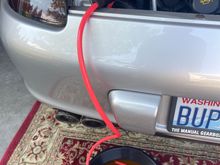 Hand-pump siphon removing old coolant 