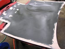 Surface is cleaned and prepped.  Depressions, defects, etc. are filled with body filler.