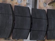 Current pads- left to right drivers side to passenger side - note wear pattern on outer pads