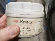 Krytox Moly based grease.
It's not going to sling off...