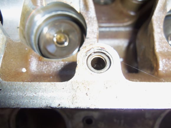One of several repaired cam cover bolt stand off holes.