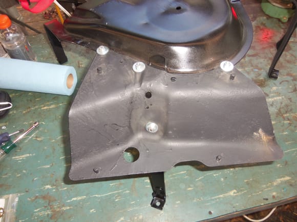 Heat shield bracket transferred to the replacement cradle.
