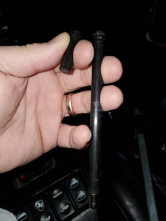 This is what my center rod looked like and just slid out. Plastic with a magnetic tip. Don't know if they're all like this or if the magnet has something to do with the aftermarket kick down switch. 