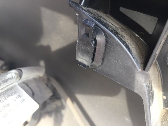 Clip on the rear bumper...connector slides up to release