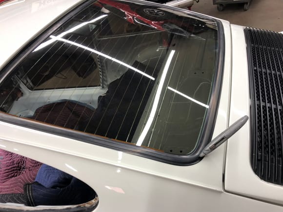 Cut the windshield seals to remove glass for respray