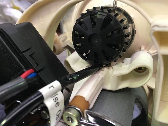 I had to grind/melt  a bit the plastic in order to create a space for the wiring loom of the LED.