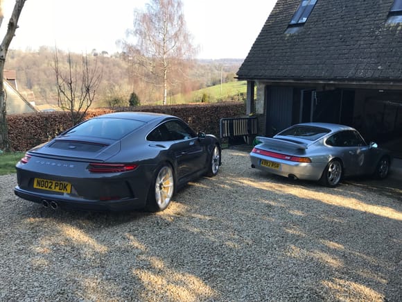 With its garage mate.

Delighted with the Touring. Has some very cool connections to older 911’s I think such as chrome trim and engine sound. I cannot detect any difference to the winged manual I drove at the PEC earlier this year. Engine note very similar to my ears. 