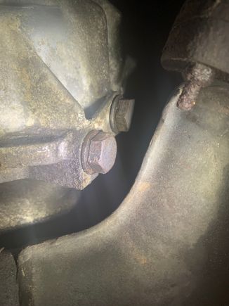 Here is caked on oil on the two bolts coming out of the bell housing 