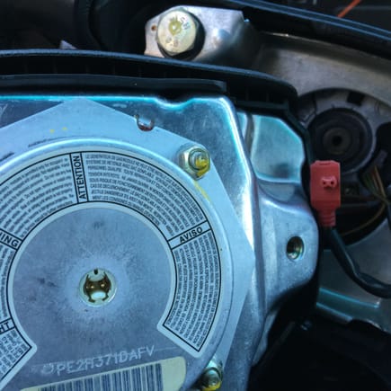 Note the two prongs that the airbag connector snaps into