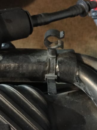 This is a clamp held on with a built in zip tie.