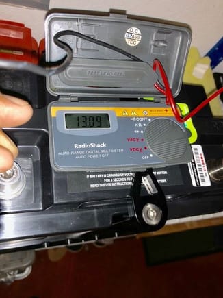 Turned on the battery to check the voltage-reads 13.09 volts and shows 2 lights on the battery meter for the battery.