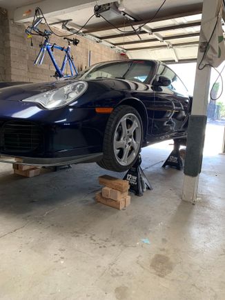 Yup on Jack stands to tackle a leaky gearbox oil pan gasket and an axle cv boot that is about to fail. 