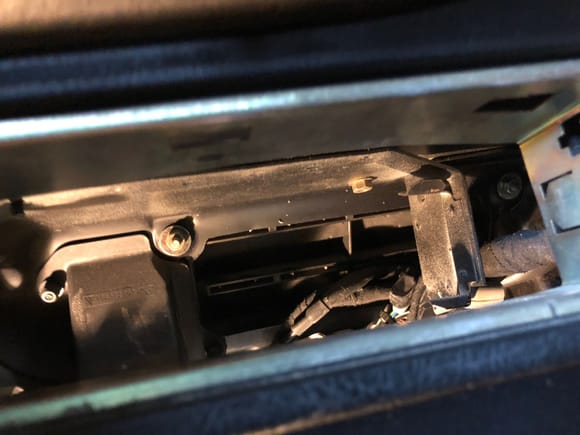 Remove nut on left and bot on right securing suitcase