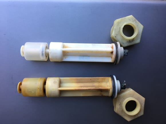 The coolant sender is the more aged/yellowed unit