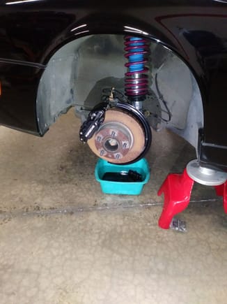 Better planning would have been to change the front shocks before replacing all the brake fluid which drains out when you disconnect the brake line to remove the old shock and attach it to the new shock.