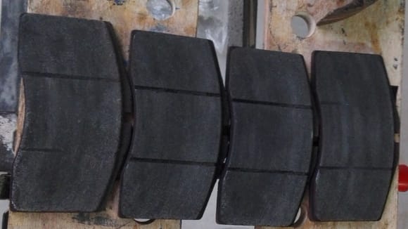 Current pads- left to right drivers side to passenger side - note wear pattern on outer pads