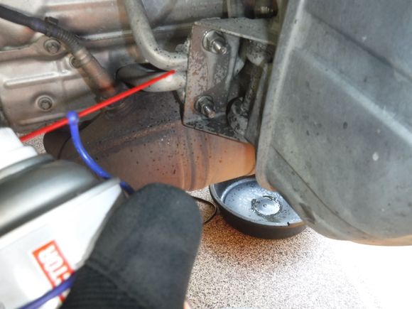 Remove the two 13mm flange nuts on the muffler support.