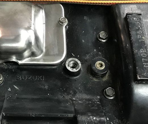 What goes in the hole to the right of the starter cover?