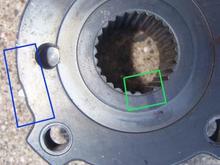 This is the crankshaft timing belt pulley as viewed from the side that faces away from the engine.
Green box points out 'keyway' for double spline on shaft.
The timing mark is the little tab peeking out from the pulley in the middle of the Blue box.