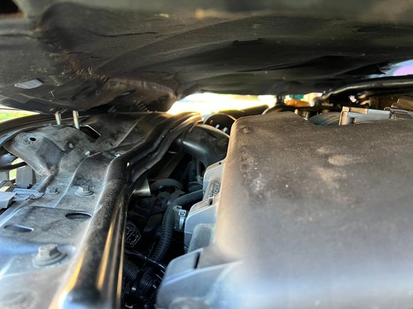 What is holding the hood down? How do I release the hood?