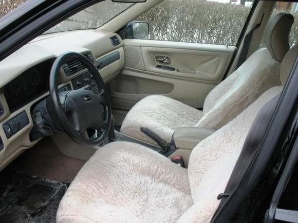 Custom fit sheepskin covers I found on kijiji for $50. Black leather steering wheel ($25) I installed to replace the worn ugly beige one. Set of Volvo winter mats $20.