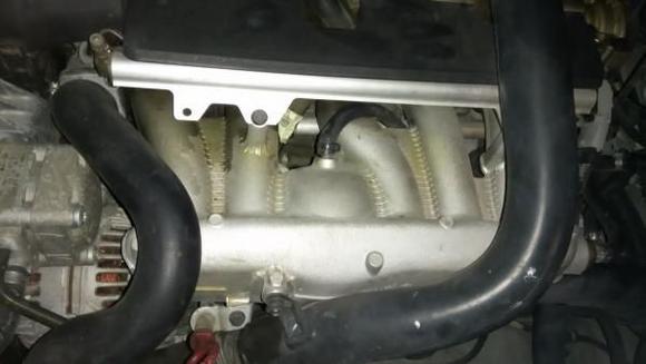 Fuel rail with newly replaced purge valve hose
