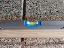 Slope of garage.  Car nose to left (slightly higher).