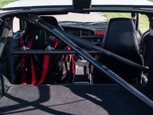 Photo with rear hatch open showing Matter cage, new(er) Schroth harnesses to compliment street seat belts. Notice Matter decals intact throughout the car.