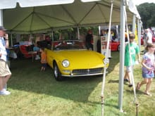 PVGP Cortile 1966 Ferrari 275 GTS. 260bhp, 3,285 cc single overhead camshaft Colombo V12 engine, five-speed synchromesh manual gearbox, four-wheel independent suspension, and four-wheel disc brakes. Wheelbase: 94.5&quot; (2,400mm)With its sleek open coachwork, designed and built by Pininfarina.