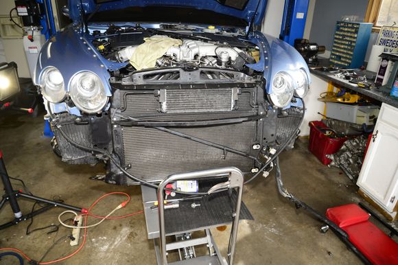 Lifting the radiator assembly into place. It was a little tricky getting all those quick connect radiator hoses to actually click into place