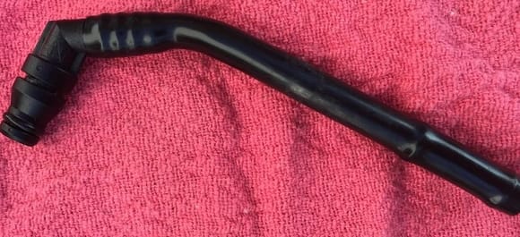 Stubby plastic hose removed from the OEM master