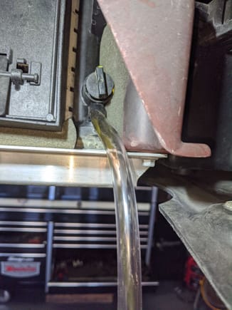 Used 3/8 ID clear tube to drain coolant from radiator. 